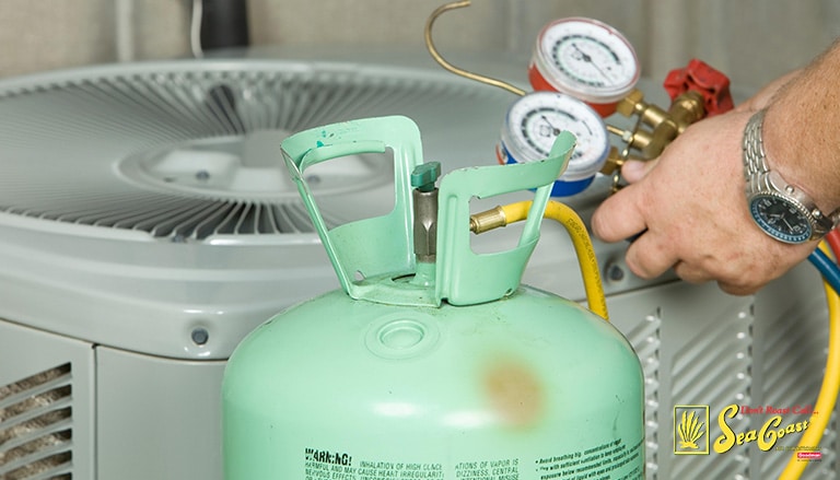 close up shot of a hvac technician checking the refrigerant