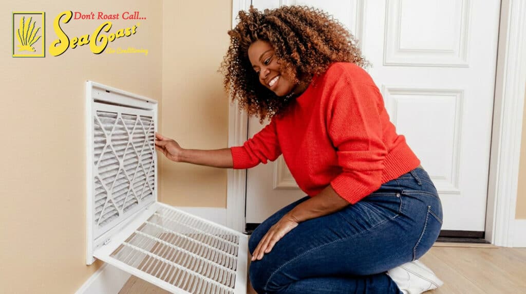 homeowner about to change her air filter